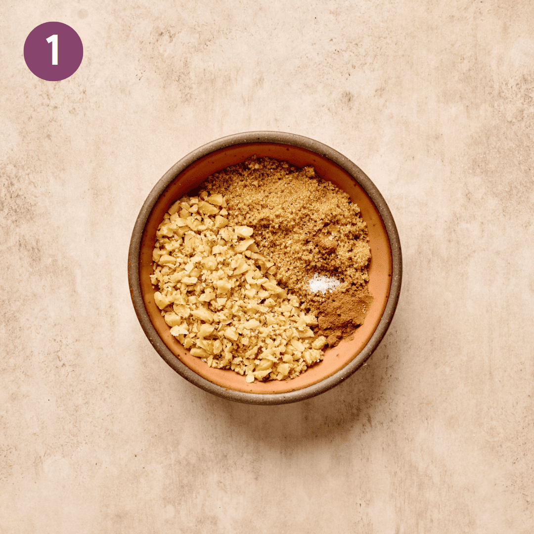 Walnut crumble ingredients in a small bowl on a table.