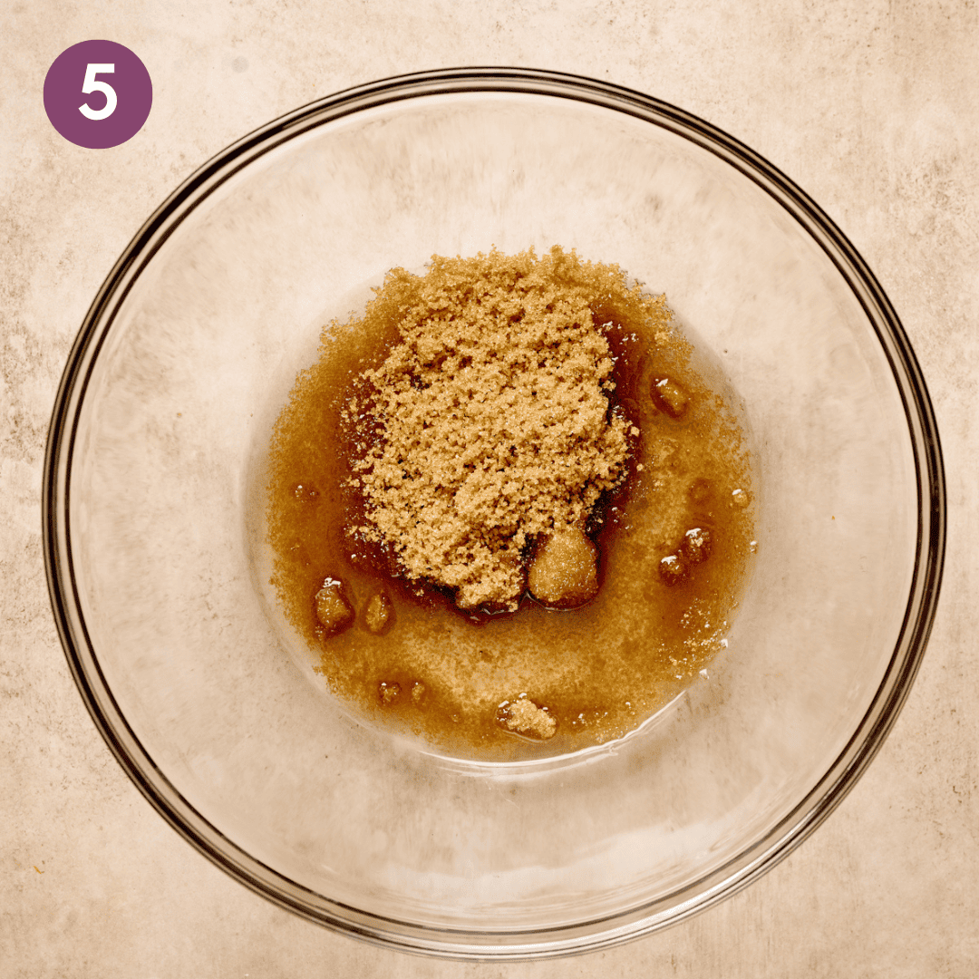 Brown sugar and oil in a large glass bowl.