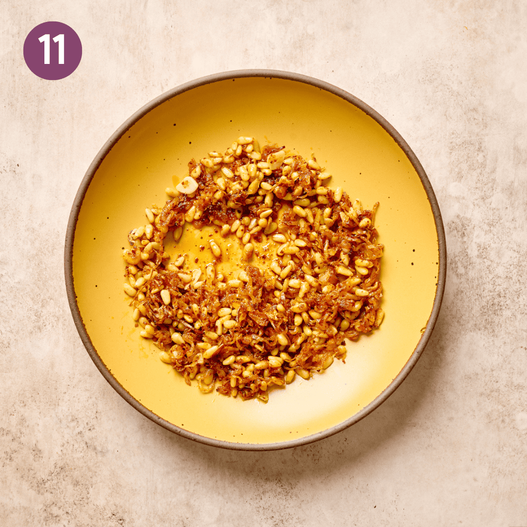 Pine nut aromatic mixture in a yellow bowl.