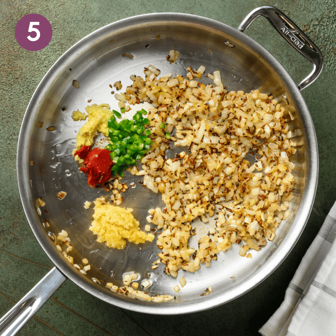garlic, ginger, green chile and tomato paste added to onion mixture.