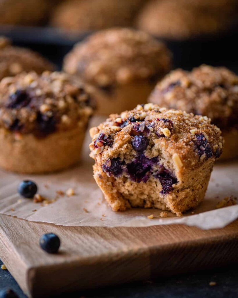 crumble topping on top of muffins in muffin tin.